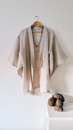 The 'Mala' Kimono  - is a one off a,  kind handmade kimono, created in delicate gentle woven linen, slightly transparentand perfectly suited for hot summer evenings.  If you are a lover of the finer things in life, then this one-off lustworthy piece of art could be the jewel of your wardrobe. A deliciously decadent robe dedicated for the dreamers and gypsies.  100% Linen - one size fits AU6 - AU12 -  is a short kimono just covers to the beginning of the thigh, below the buttock area If you aren't sure of the size, send me your measurements. Kimono hand made in Australia One of a kind creation Long Linen Kimono For Summer, Elegant Linen Kimono For Summer, Elegant Linen Summer Kimono, Summer Long Linen Kimono, Handmade Long Sleeve Kimono For Summer, Long Summer Kimono With Natural Dye, Linen Kimono With Relaxed Fit, Summer Linen Wrap Kimono, Spring Beach Kimono With Natural Dye