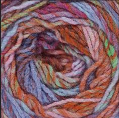 the yarn is multicolored and ready to be used in knitting or crochet