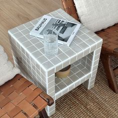 a small table with a magazine on it