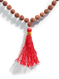 This set of Prayer Beads, a Mala or Rosary, is made of finely selected, peppercorn sized, five Mukhi Rudraksha mala beads. Thread-knotted in traditional style with red tassel, this Rudraksha rosary is best for doing Japa or chanting mantras to all deities. You may keep the healing mala in your puja altar for positive vibrations or as a garland for your deity idol. You may also wear it around your neck. It is best to avoid wearing this with other Rudraksha combinations. Measures 34 inches long wh Hand-strung Beaded Necklaces As Festival Gifts, Festive Hand-strung Beaded Necklaces As Gifts, Traditional Jewelry For Meditation With 8mm Beads, Traditional 8mm Beads Jewelry For Meditation, Traditional Jewelry With 8mm Beads For Meditation, Traditional Necklaces With 8mm Beads For Rituals, Traditional Hand-strung Beaded Necklaces For Festivals, Traditional Brown Mala For Rituals, Traditional Hand Knotted Mala For Rituals