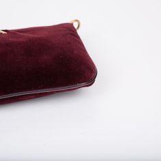 Carefully crafted from romantic, burgundy velvet, Prada presents this stunning pouch with gold tone hardware and chain strap. The perfect accessory for any woman who doesn't have a lot to carry. Featuring four card slots and a tiny compartment ideal for carrying loose change and some bills. Dress this bag up with a blouse and some heels, or dress it down with jeans and a basic tee for a more casual look when you're running errands or doing the grocery shopping. SPL Exterior Burgundy velvet Gold tone hardware Chain strap Prada embossed logo Brand new condition Interior Burgundy leather interior Tiny compartment Four card slots Brand new condition Comes with dustbag, box, and cards SPL Height 10.0cm Width 16.0cm Depth 2.0cm Loose Change, Burgundy Velvet, Basic Tee, Grocery Shopping, Exclusive Bag, Embossed Logo, Leather Interior, Handbag Backpack, New Bag