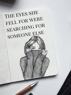 an open notebook with a drawing of a woman covering her face and the words, the eyes she fell for were searching for someone else