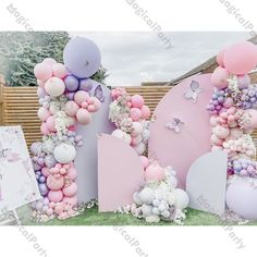 balloons and flowers are arranged in the shape of letters