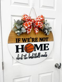 a door hanger that says if we're not home check the basketball court