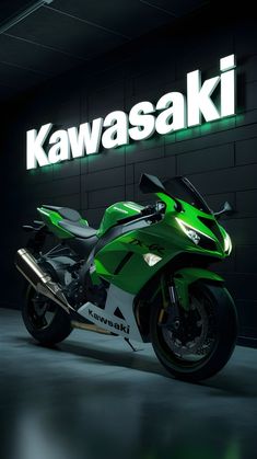 a green motorcycle parked in front of a kawasaki sign