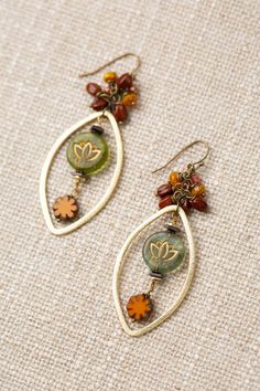 The Czech Glass Collection offers a varied selection of handcrafted earrings, including this eye-catching statement design. Antique Brass (Lead & Nickel Free) Czech Glass 2.75" with antique brass ear wires We hand select our natural materials, thus there may be slight variations in color and/or size that will not detract from the overall aesthetic. Our unique handcrafted designer jewelry for women is made in America, each design created individually in our personal design studio in Floyd, VA USA Nickel-free Teardrop Czech Glass Jewelry, Handmade Antique Gold Teardrop Jewelry, Amber Colored Nickel Free Czech Glass Jewelry, Nickel-free Amber Czech Glass Jewelry, Amber Czech Glass Nickel-free Jewelry, Amber Nickel-free Czech Glass Jewelry, Earthy Gold Jewelry With Gemstones, Handmade Czech Glass Bronze Jewelry, Handmade Bronze Jewelry With Czech Glass