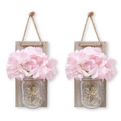 two mason jar wall hangings with pink flowers