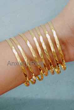 18kt Gold Filled Bangles,Personalized bangle bracelets for women,Bridesmaid gift ideas,Custom bracelet simple,Bridesmaid Jewelry if you want more design in bangle please contact me Available in different sizes if you have any confusion about size please send a message i will solve your problem We maintain 100% customer satisfaction. Your Feedback is very important for us. When you Receive the Item , Please leave us a positive Feedback. Positive feedback is greatly Appreciated, and We will also leave you a positive Feedback. If you are Unsatisfied with any Reason, Do not Leave a Medium or Negative Feedback. Give us a chance. We will Quickly address the problem and give a satisfactory answer. If you have any Question or Query please contact through etsy message. If you have any questions or Simple Bridesmaid Jewelry, Plain Gold Bangles, Bangle Bracelet Gold, Unique Bangle, Hammered Bangles, Gold Bangle Set, Bridesmaid Gift Ideas, Womens Bangles, Bangles Gold