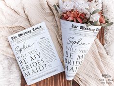 two paper cones that have flowers in them on top of a bed with the words, will you be my bride's maid?