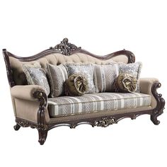 an ornate couch with many pillows on it's back and arms, sitting against a white background