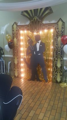 a man in a tuxedo standing at the entrance to a party