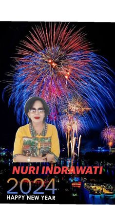 an image of a woman with fireworks in the background and text that reads nuri indrawati happy new year