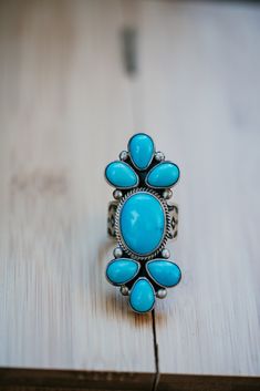 The Rhona ring is bold, stunning and needed in your collection! Turquoise stone Different variations: Blue, Lt. Blue and Green Thick stamped band Measures 2 inches 7 Large Turquoise stones Because of the thick band on this ring, we suggest sizing at least a half size up. Please note that if the item ends in .99, it is final sale. Ring Turquoise, Turquoise Stones, Turquoise Rings, Light Turquoise, Turquoise Stone, Turquoise Ring, Natural Stones, Final Sale, Product Launch