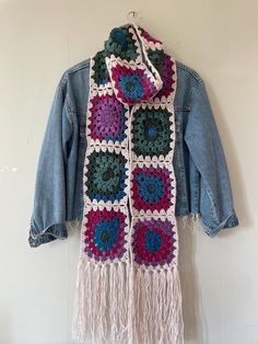 Elevate your style with our Best Selling Granny Square Long Scarf! This multicolor crochet masterpiece is inspired by celebrity trends and is the ultimate statement accessory for any fashion-forward individual. Featuring the timeless charm of Granny Square patchwork, this long scarf brings vibrant colors and intricate patterns together in a striking, handmade design. Suitable for both men and women, this unisex scarf offers a perfect mix of comfort and style. Its extra-long length provides endle Black And White Granny Square, Granny Square Scarf, Square Patchwork, Multicolor Crochet, Scarf Handmade, Celebrity Trends, Granny Square Crochet Pattern, Inspirational Celebrities, Boho Look