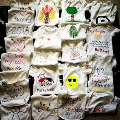 a bunch of baby ones that have been embroidered on to the back of their shirts