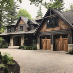 a large house with two garages on each side