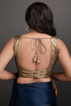 Presenting this luxuriously designed Antique Sequins blouse on georgette fabric. Perfect for luminous evening parties and festive occasions. Pairs well with any saree for a classic look. Blouse Color : Dull Gold Blouse Fabric : Georgette Sequin Fabric Blouse Design: As seen - Front Deep V and back Deep U Closure: Back Sizing: Not stretchable - margin of 2 inches inside seams for adjustments Custom Options: Not Customizable Work : Sequin Occasion : Party Disclaimer: There will be slight differenc Deep Back Blouse Design, Fabric Blouse Design, Noodle Strap Blouse, Lengha Blouse, Lengha Blouse Designs, One Minute Saree, Gold Saree, Golden Blouse, Noodle Strap