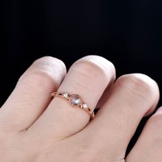 This is a dainty moonstone & diamond engagement ring. A perfect anniversary gift, birthday gift,wedding engagement ring.Great as a gift or a anniversary ring. Ring Information Stones *4mm round cut Natural moonstone. *Natural Real Diamonds. SI Clarity and H Color. Metal * Solid 10k 14k &18k. *Color:white gold,yellow gold,rose gold. Custom Order *The main stone can be other gemstones you can imagine,any birthstone can be made.Please contact me if you need this service. *Any size *I can al Rose Gold Moonstone Ring, Moonstone Engagement Ring Rose Gold, Gold Moonstone Ring, Opal Wedding Band, Opal Wedding, Ring Moonstone, Petite Ring, Emerald Ring Gold, Engagement Ring Rose Gold