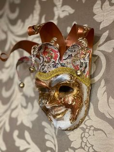 Original Venetian make mask made entirely by hand and decorated by hand in acrylic colors, gold leaf.Decorative only maskMeasurements about 18x16All our masks are handmade by our staff (me, my wife and our collaborators) in our atelier in Venice. The masks are all made of paperweight and are made using ancient techniques from the 1300sThey are decorated with acrylic colors, gold leaf, silver leaf, trifies, lace and Swarovski crystals so as to make them more valuable.We are a small family busines Mask Ball, Ancient Techniques, Mask Wall, Female Mask, Venetian Masks, Wall Mask, Venetian Mask, Carnival Masks