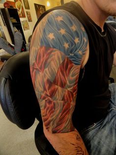 a man with an american flag tattoo on his arm