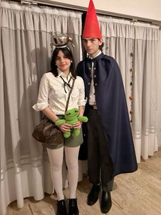 a man and woman dressed up in costumes