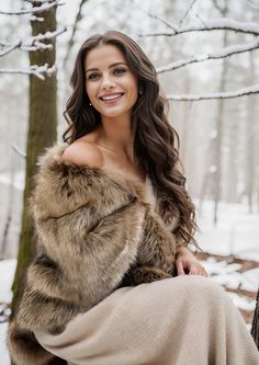 a woman in a fur coat sitting on a tree