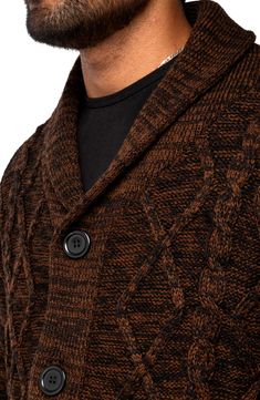 A super soft, plush knit sweater with a buttoned down front will keep you feeling snugly warm during any chilly day. Fit: this style fits true to size. 30" length (size L) Shawl collar Long sleeves Front button closure Cable knit construction Ribbed trim 70% acrylic, 30% polyester Dry clean only Imported Model stats: 6'1" height, 32" waist. Model is wearing size L. Casual Brown Cable Knit Sweater, Casual Brown Wool Sweater Coat, Casual Brown Wool Cardigan, Casual Brown Sweater For Cold Weather, Brown Winter Sweater Coat With Buttons, Brown Buttoned Sweater Coat For Winter, Brown Knit Sweater Coat With Button Closure, Brown Buttoned Sweater For Winter, Cozy Black Button-up Outerwear