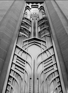 an architectural design on the side of a building in black and white, as seen from below