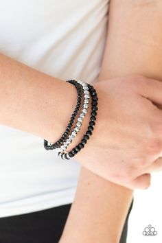 A collection of faceted black and silver beads are threaded along stretchy bands around the wrist. White rhinestone encrusted rings are added to one strand for a refined finish. Sold as one set of three bracelets. P9RE-BKXX-242XX Trendy Fringe, Silver Bead Bracelet, Ball Necklace, Black Bracelets, Paparazzi Accessories, Bead Bracelets, Stretchy Bracelets, White Rhinestone, Silver Bead