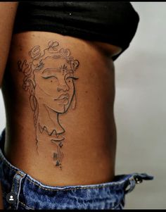 a woman with a tattoo on her stomach