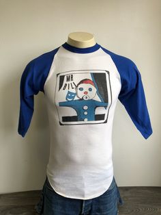 Mr. Bill 70s Jersey Shirt A very unique rare Mr. Bill shirt. A great piece from the 70s. Take Mr. Bill on all your adventures with this shirt. Condition: Excellent preowned condition. Just a few light marks and and some piling. Overall Great shirt! See a smashing selection of vintage tees in my shop https://www.etsy.com/shop/sweetVTGtshirt?section_id=11916470&ref=shopsection_leftnav_3 Measurements (Inches): Pit to Pit: 15 1/2 Waist: 15 1/2 Sleeves from shoulders: 19 Total length: 27 Size: Ta Snl Characters, Mr Bill, Bills Shirts, Jersey Vintage, Night Live, Snl, Saturday Night Live, Jersey Shirt, Saturday Night