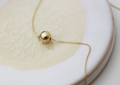 "Minimalistic, classy and elegant! This necklace is perfect for any occasion. Shinny Beads in sterling silver or gold filled. A perfectly Shinny ball bead pendants threated on a delicate feminine 14K gold filled chain. Simple and dainty gold ball necklace, featuring 14K gold filled ball and chain /Sterling silver ball and chain. ■ Turn this necklace also a Back necklace! Check out our clip on Back Necklace Chain : https://www.etsy.com/listing/250871895/mini-bead-back-necklace-dainty-beck-drop?re Elegant Ball Chain Necklace As Gift, Minimalist Round Bead Necklaces For Gifts, Elegant Ball Chain Necklace For Gift, Minimalist Wedding Necklace With Satellite Chain, Dainty Ball Chain Necklaces As Gifts, Dainty Ball Chain Necklace For Gift, Minimalist Ball Chain Necklace As Gift, Minimalist Ball Chain Jewelry Gift, Minimalist Ball Chain Necklace For Gift