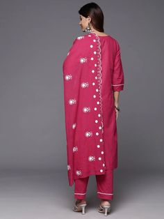 Grab this beautiful 3-piece set. The set comes with floral embroidered straight shape kurta has rpund neck, 3/4th sleeves & calf length teamed with solid trouser pant with side pocket and a dupatta. Color - Magenta Kurta Fabric-Cotton Pant Fabric-Cotton Dupatta Fabric - Cotton Neck-Round Neck Sleeves-3/4th Sleeves Work -Floral Embroidery Detailing Washing Instructions-Dry Clean DISCLAIMER - The color of the product may be differ due to screen settings of device. A misprint here and a color drop slip there is the beauty of printing which is not treated as a defect. Pink Palazzo Set With Embroidered Border And Straight Kurta, Floral Embroidered Pink Pant Set For Eid, Pink Floral Embroidered Pant Set For Eid, Eid Floral Embroidery Pant Set With Straight Kurta, Pink Straight Kurta Set With Embroidered Border, Pink Straight Kurta Pant Set With Zari Work, Pink Pant Set With Zari Work And Straight Kurta, Festive Cotton Pant Set With Floral Embroidery, Cotton Pant Set With Floral Embroidery For Eid