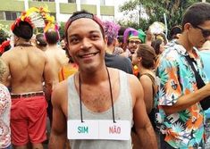 a man standing in front of a group of people wearing headbands and bandanas