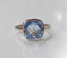 A minimalist classic Square Shaped Blue Quartz hand set in a bezel setting that elegantly holds the stone, featuring handcrafted in sterling silver. This beauty makes a great birthstone ring for those December Birthday gals and a great ring to stack with our other gemstone rings! Wrapped in a box ready for gift giving.(r-b-6) RING INFO ---------------- STERLING SILVER STONE SIZE 9MM (0.35inches) DECEMBER BIRTHSTONE Visit our Ring Section https://www.etsy.com/shop/Belesas?section_id=11187900& Minimalist Blue Topaz Birthstone Ring, Elegant Blue Stackable Rings With Bezel Setting, Elegant Blue Sterling Silver Stackable Rings, Modern Blue Sapphire Ring In Sterling Silver, Elegant Blue Birthstone Ring With Bezel Setting, Blue Sapphire Topaz Ring With Bezel Setting, Blue Round Stackable Rings For Formal Occasions, Elegant Blue Rings With Bezel Setting, Classic Blue Ring With Bezel Setting