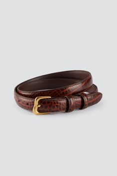 A classic narrow belt made from genuine leather. Croc design. Buckle made from zinc alloy. Comes in a branded box and a cotton dust bag. This belt is the perfect addition to any wardrobe, adding timeless class to every look. 100% Leather  Color: Brown Suitable for high waisted fits. Model wears: XS-S Model's measuremen Silver Logo, Leather Gifts, Off White Color, Active Wear Tops, S Models, Tank Shirt, Tank Top Shirt, Zinc Alloy, Sunglasses Accessories