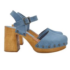 Supported by a practical heel, solid and incredibly comfortable, our Dutch-style sandals are sure to stand out and are easy to combine with all kinds of looks. Clogs with light brown wood effect base Sky blue leather upper Soft leather insole Adjustable ankle strap Heel height 8.5 cm with 3.5 cm plateau Comfortable and elegant Made entirely by specialized Italian personnel Handcrafted products using the best materials. BEFORE PURCHASING DO NOT FORGET TO CHECK THE SIZE! Summer Slingback Pumps With Wooden Heel And Round Toe, Casual Slingback Heels With Buckle Closure, Chic Clogs With Heel Strap And Open Heel, Casual Slingback Pumps With Buckle And Block Heel, Casual Mules With Heel And Ankle Strap, Casual Heels With Ankle Strap, Summer Slingback Pumps With Wooden Heel And Ankle Strap, Summer Sandals With Ankle Strap And Deep Heel Cup, Casual High Heel Slingback Pumps With Buckle Closure