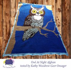 an owl is sitting on a tree branch in front of a wooden fence with the words owl at night afghan restted by kathy wood - geiger