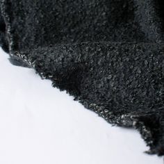 Snuggle up in this high end designer 100% wool Boucle sweater knit! This is fabric has a heavy weight and a mechanical stretch which will sew up a lovely sweater, cardigan, jacket or wrap. Close up photo. Cozy Black Wool Outerwear, Black Soft Texture Sweater For Fall, Black Soft Textured Sweater For Fall, Soft Black Fall Sweater, Soft Black Sweater For Fall, Charcoal Wool Sweater For Fall, Black Wool Cardigan For Cold Weather, Cozy Textured Knit Black Outerwear, Cozy Black Textured Knit Outerwear