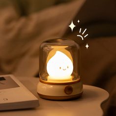 an alarm clock sitting on top of a table