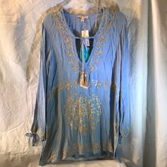 New With Tags. Gold Embroidery Denim Tunic, Women Rising, Gold Embroidery, Faded Denim, Tie Top, Blue Gold, Tunic Tops, Free People, Color Blue