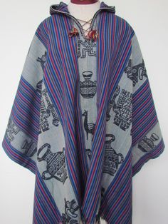 "This is a beautiful and bright Blue wool-blend Shaman's Poncho with traditional Andean symbols and accents. This poncho is handwoven in the Sacred Valley of the Incas, the Andes of Peru in South America. Made in Peru Standard size: Size: 35\" L x 51\" W" Traditional Blue One-size Poncho, Traditional Blue Poncho, Bohemian Blue Cape Poncho, Blue Long Sleeve Poncho For Festivals, Blue Long Sleeve Festival Poncho, Peruvian Poncho, Sacred Valley, Hooded Poncho, Blue Wool