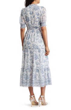 Flourishing blooms bring garden-inspired glory to a sweeping chiffon dress designed with a tiered hem and smocked waist. 52 1/2" length Short sleeves 100% polyester Machine wash, line dry Imported Floral Toile, Tiered Midi Dress, Garden Inspired, Max Studio, Tiered Dress, Chiffon Dress, Blue Floral, Designer Dresses, Chiffon