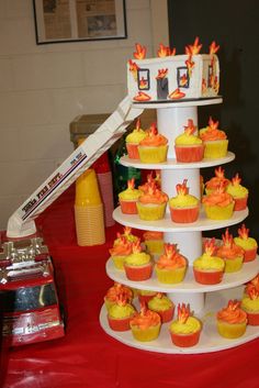 cupcakes are arranged in the shape of a tower