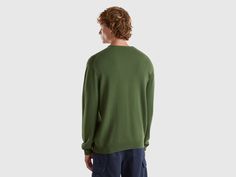 Sweater with V-neck in pure Merino wool, warm, lightweight and pleasant to the touch. A basic and versatile garment, suitable for different occasions of use. The presence of the Woolmark logo guarantees the high quality of the garments through the application and monitoring of specific standards in the production of wool, from breeding to the final product. Casual V-neck Merino Wool Top, Casual Merino Wool V-neck Top, Casual Wool V-neck Top, Casual Green Wool Tops, Green Wool Casual Tops, Casual Merino Wool Cardigan, Dungaree Skirt, Jumpsuit Skirt, Blouse Dress