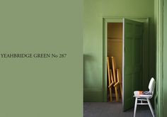 a green room with two chairs and a white chair in the corner that says yeahbridge green no 27