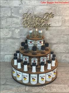 a cake that has some bottles on it and is decorated with the words happy birthday