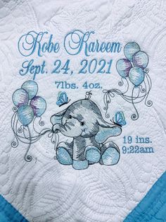 an elephant with balloons on it's back and the birth date written in blue