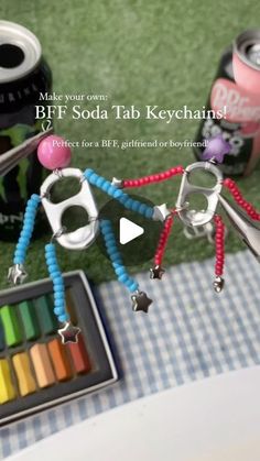 there are many items on the table with text above them that says, make your own bff soda tab keychains