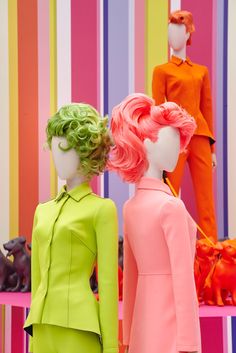 two mannequins dressed in neon colored clothing